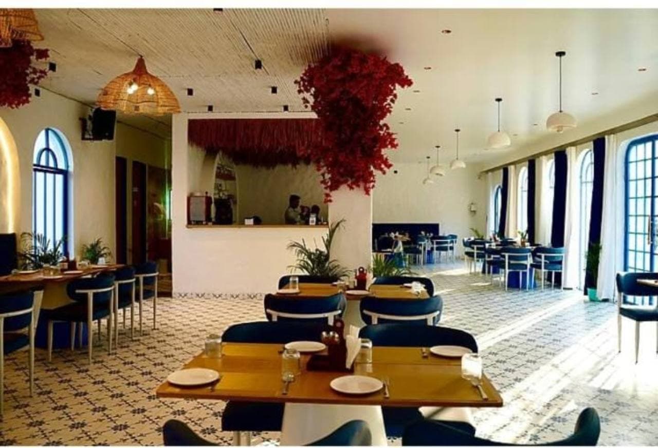 A bright dining area with tables and seating.