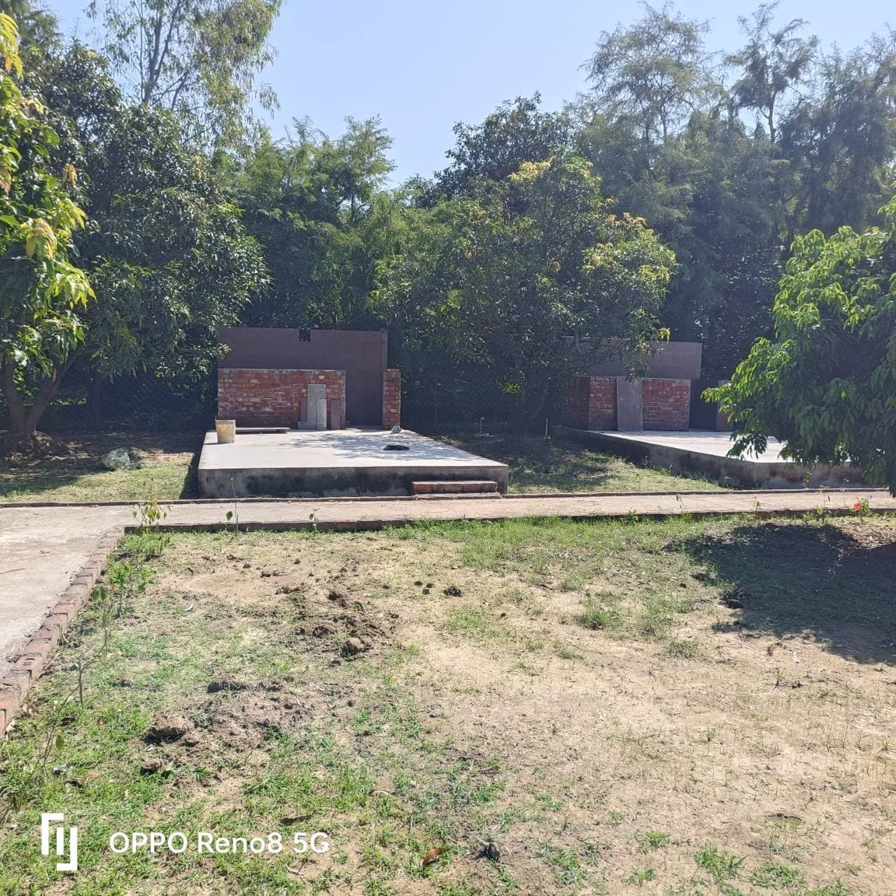 A construction area among trees on the property.